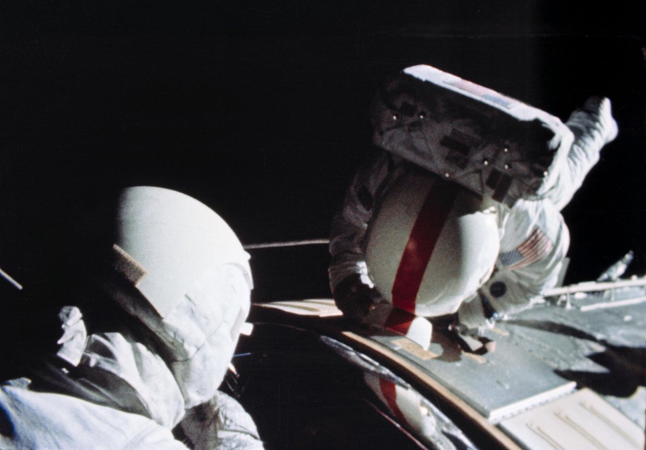 Real NASA photograph S72-37001, a frame from the same 16mm Maurer Data Acquisition Camera that exposed the "UFO" footage. It shows Command Module Pilot Ken Mattingly performing the Apollo 16 deep-space trans-Earth EVA on 25 April 1972, working outside the Command/Service Module amid the external booms and hardware near the SIM bay. This is the spacecraft-exterior context in which NASA's analysts identified the "saucer" as a floodlight on an extended boom. It is a documentary mission photograph, not the disputed "saucer" frame and not a recreation.