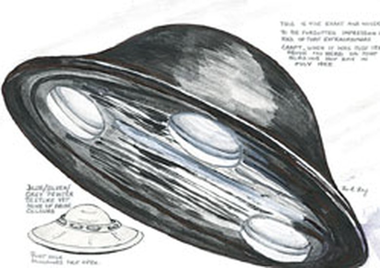 Margaret Fry's own hand-drawn witness sketch of the craft she reported seeing about 18 feet above her head in King Harold's Way, Bexleyheath, at noon on 17 July 1955. The drawing shows the saucer-shaped object with the inset underside spheres she described, and carries her handwritten notes recording its "blue/silver/grey/pewter, yet none of those colours" surface and her caption that it is the exact impression she had of the craft. This is a witness sketch, not a photograph or a render.