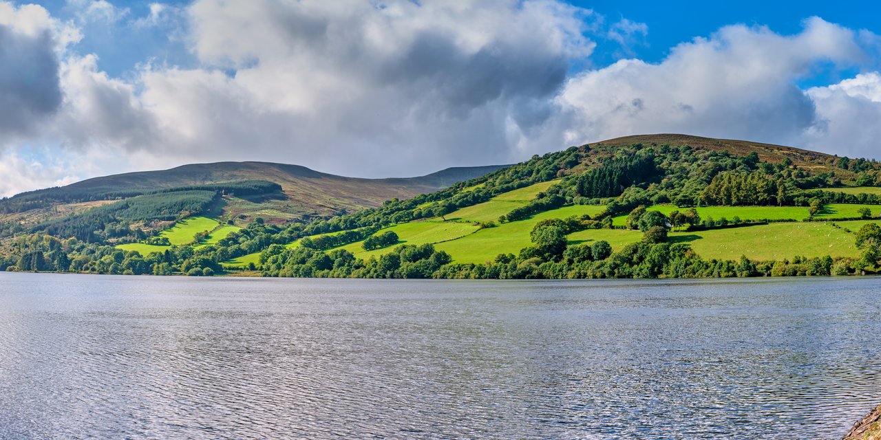 Talybont Reservoir on the moorland of the Brecon Beacons, Powys, the upland the witnesses were crossing when they reported a large, silent, multi-lighted object descending beside their car in November 1989. This is a real 2019 landscape photograph of the location, not an image of the object, which was never photographed.