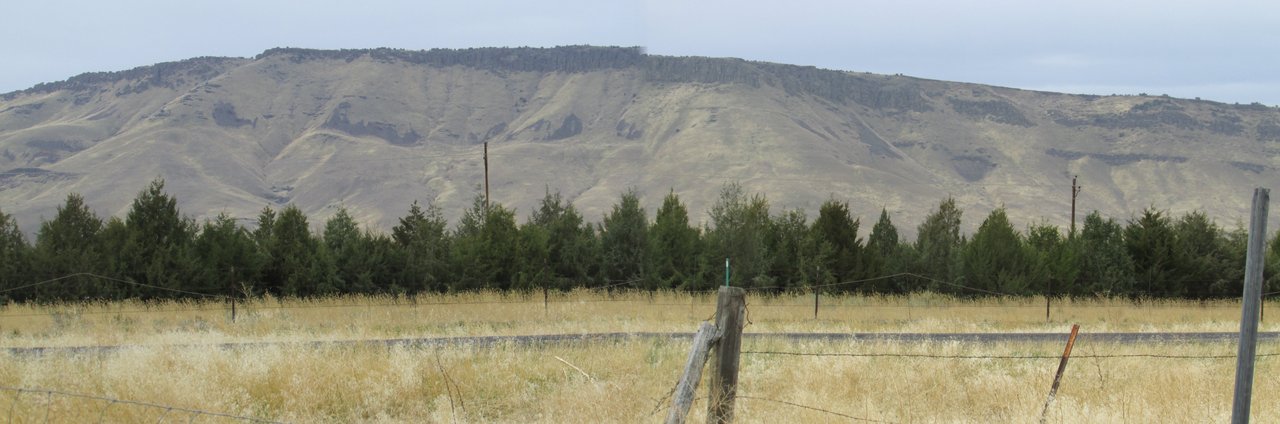 A modern panoramic photograph of the Promontory Mountains across the Bear River Basin on the northeast corner of the Great Salt Lake, Utah. This is the terrain to the west of Brigham City that Mrs. L. P. Cragin reported looking toward when she saw a shiny dome-shaped object on the ground near "the Promontory" on 7 May 1968. This is a present-day landscape photograph of the location, not an image of the reported object; no contemporary photo or sketch of the object is known to exist.