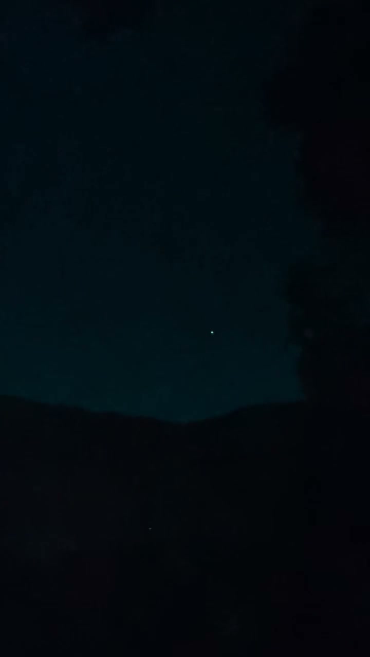The full frame at 46.5 seconds at native scale, with the Black Mountains ridge silhouette across the lower part of the image. The object is a few pixels across, which is why the enlargement above is used as the main plate.