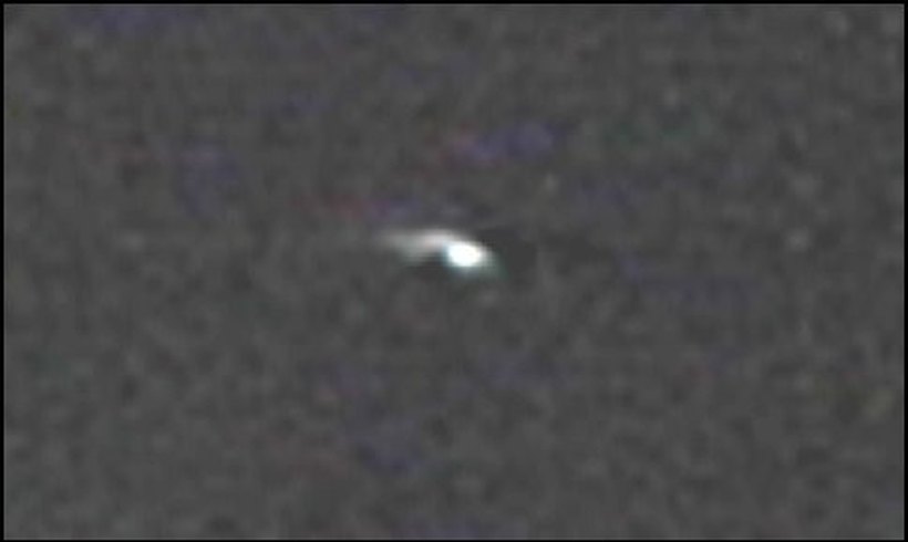 A still frame from the camcorder video shot by MUFON field investigator Scott Wilkerson near Corydon, Indiana on the night of 23 August 1987, showing the orange light low in the sky. This is a real video frame, not a recreation.