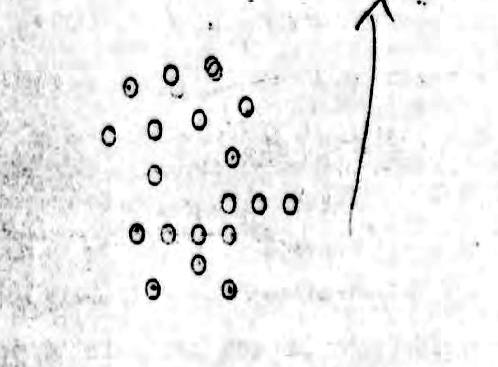 The formation sketch filed with the 72nd Reconnaissance Squadron's report. The letter explains that the circles indicate individual objects and the arrow indicates direction of flight. About twenty circles are drawn in a loose scatter with no regular spacing, which is the shotgun blast pattern the two officers described.