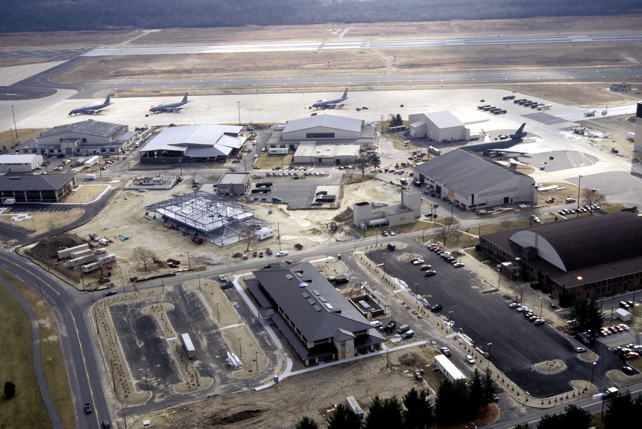 A real U.S. Air Force aerial photograph of McGuire Air Force Base, New Jersey, the installation where the alleged entity is said to have collapsed and died on a disused runway. KC-135 Stratotanker and KC-10A Extender aircraft are visible on the flight line. This is an authentic base photograph, not a depiction of the incident, which produced no released imagery.