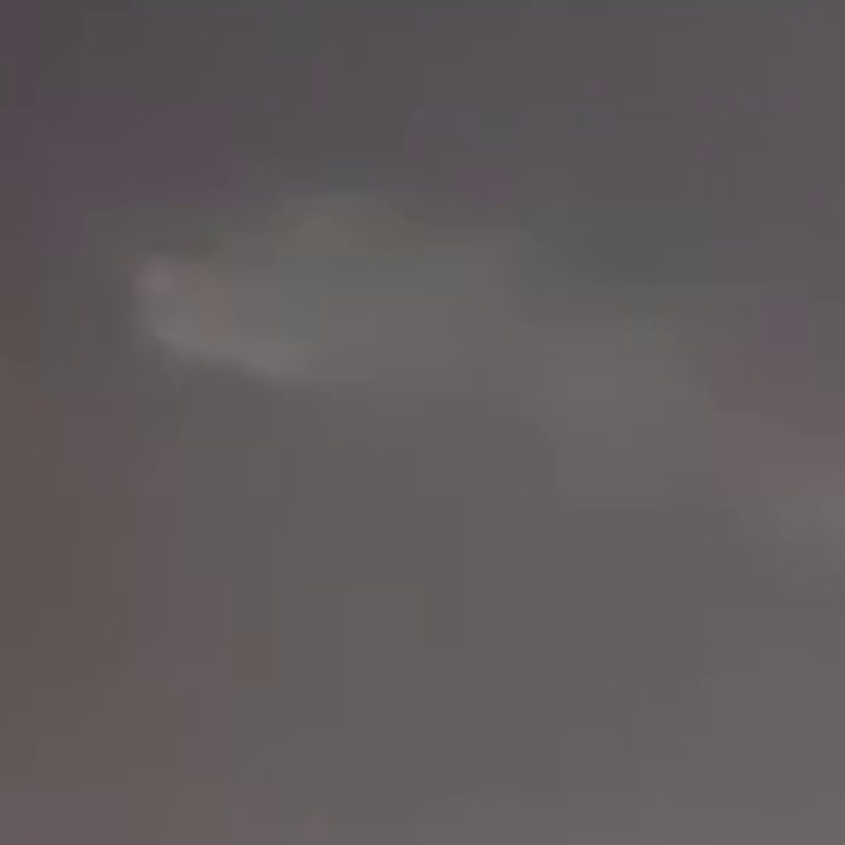 The object at nine times enlargement. It is a real feature in the recording, standing 35.7 grey levels above the local sky against a 1.85 grey level noise floor, but it resolves into no shape at all. There is no disk, no edge and no internal structure, which is why the report classifying it as a disk at under fifty feet cannot be supported.