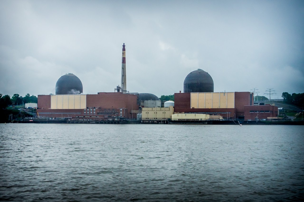 The Indian Point Energy Center seen from the Hudson River, showing the reactor containment domes. This is a real 2012 photograph of the plant, not an image of the 1984 object; no authenticated photograph of the reported craft exists, and the only contemporary imagery is the witness sketches printed in the book Night Siege. The object was reported to have hovered roughly three hundred feet above the Reactor 3 dome on the night of 24 July 1984.