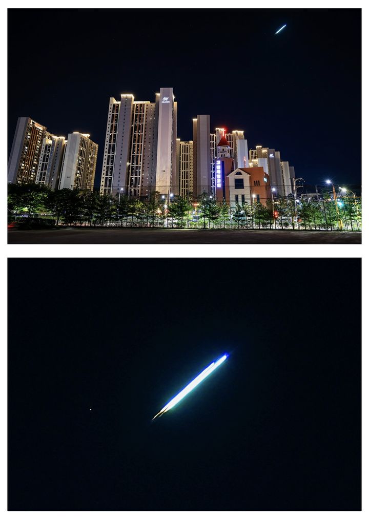 The only photograph of the 7 September 2026 object with documented provenance, taken from Yongin in Gyeonggi Province at about 20:50 by a member of the Naver amateur astronomy community Byeolhaneuljigi and published by Newsis. The upper panel is the wide frame, showing the object as a short bright streak above the apartment blocks. The lower panel is the magnified crop, and it is the evidence: an elongated trail with a bright blue white leading head, a green tinged body, and two distinct luminous segments running in line, which is the terminal fragmentation the photographer described when he wrote that it separated into two pieces and immediately went out.