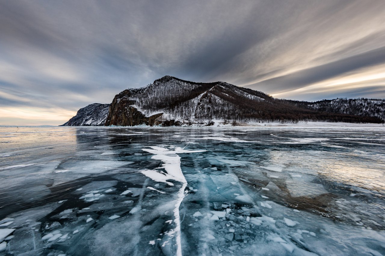 A real photograph of the frozen surface of Lake Baikal near Olkhon Island, the deep Siberian lake the case is named for. This is the setting, not a depiction of the reported event. No authentic photograph, film, or witness sketch of the alleged underwater "swimmers" exists, because the entire case survives only as a written account.