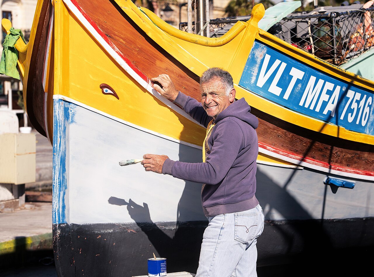 A traditional Maltese luzzu fishing boat, the kind worked by the fishermen who reported the glowing submarine-like object and its small crew off Malta in June 1947. No photograph of the object exists, so this is a locator of the setting.