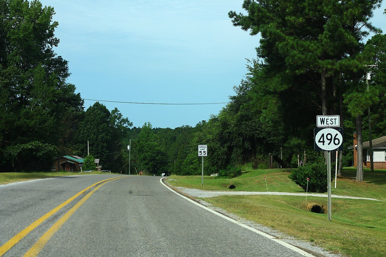 A rural two-lane highway in Lauderdale County, Mississippi, the kind of lonely road where the 1967 car-stop encounter took place near Lizelia. No photograph of the object exists, so this is a representative locator.