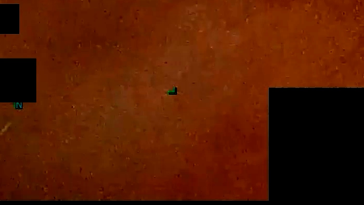 A magnified region of DOW-UAP-PR140 at 29 seconds. The terrain texture at this magnification is comparable in contrast to the objects themselves, which is why this archive makes no identification from the imagery.