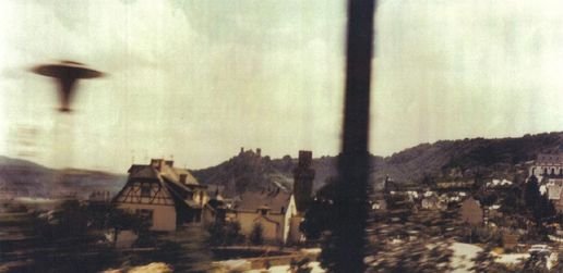 The same image as filed by the Caelestia investigation project, which catalogs it as a trackside lamp post motion-blurred from the moving train.