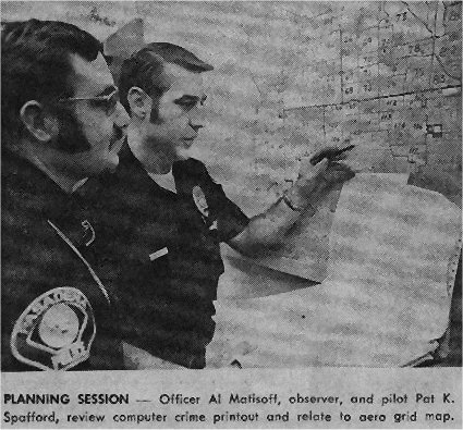 A Pasadena Star News press photograph, dated 13 February 1972, captioned "PLANNING SESSION - Officer Al Matisoff, observer, and pilot Pat K. Spafford, review computer crime printout and relate to aero grid map." This is a real newspaper photograph of the two Pasadena Police air-crew members who reported the October 1972 encounter. It is not a photograph of the object; no image of the object exists, because the crew's searchlight was never put on it.