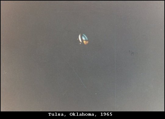 Alan Smith original 1965 photograph of the glowing, multicolored object over Tulsa, taken when he was a teenager during the August 1965 Oklahoma flap. This is the actual photograph at the center of the case.