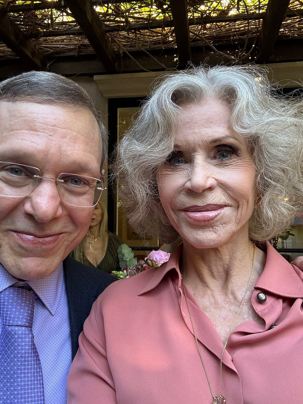 Avi Loeb with Jane Fonda at the salon. Loeb published this photograph in his essay of 4 October 2026 and credits the picture to Fonda. His clothing matches the group photograph above, which is the archive's own check that the two pictures come from the same gathering.