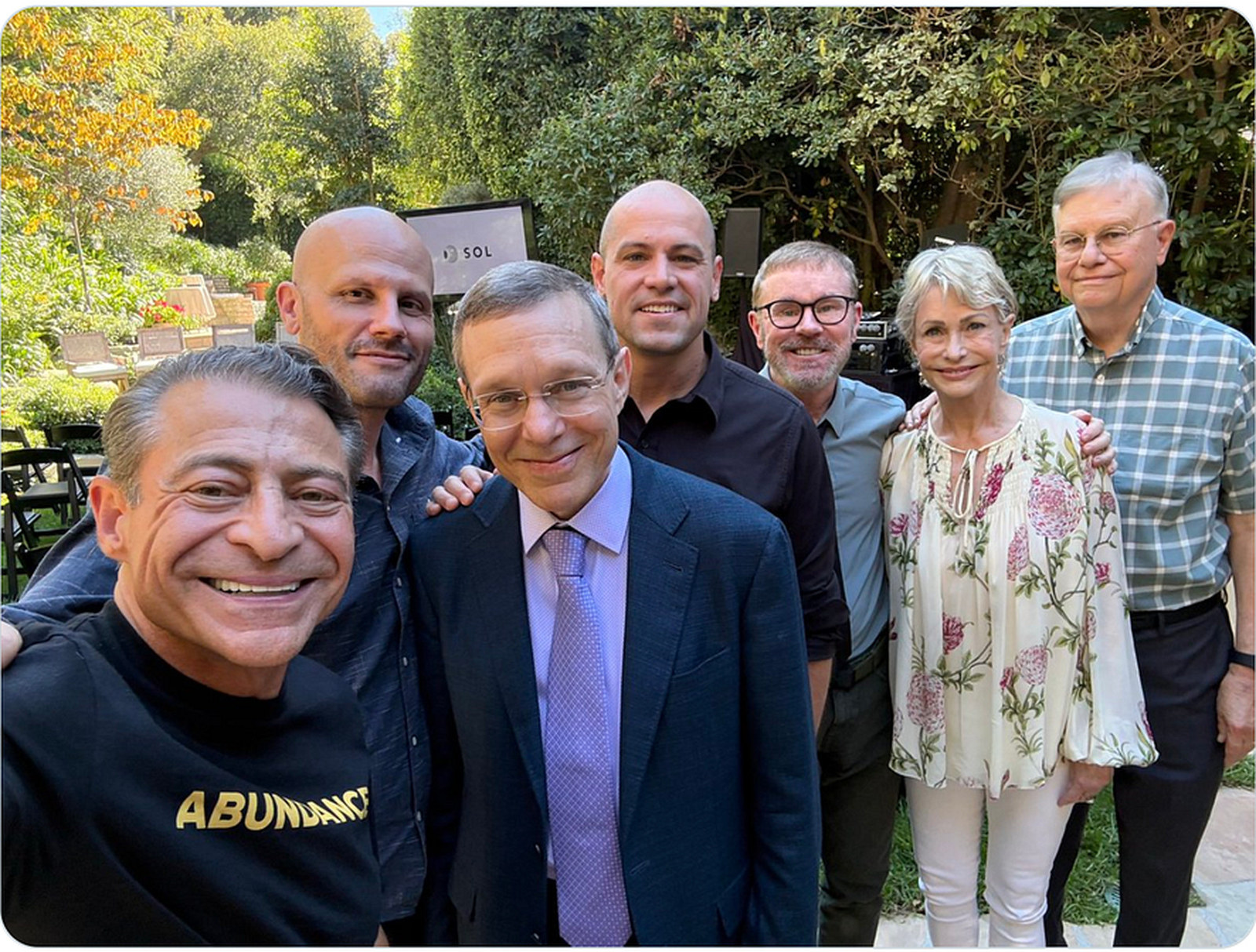 Peter Diamandis, in the foreground, photographed at the UAP salon he hosted at his Los Angeles home. His own caption on the picture names those present as Avi Loeb, Garry Nolan, Whitley Strieber, Peter Skafish and Ryan Graves. Eight people appear in the photograph and his caption identifies six, so not everyone shown is named.