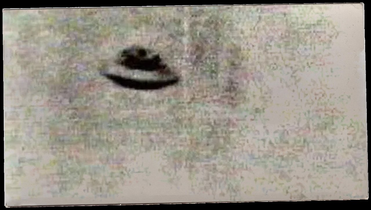 The Gordon Faulkner photograph of "the Warminster Thing," a grainy black-and-white image of a domed disc against a hazy sky, taken on 29 August 1965 and published by the Daily Mirror on 10 September 1965. It became the emblematic image of the case and the cover of Arthur Shuttlewood's 1967 book The Warminster Mystery. Its authenticity is disputed: a man named Roger Hooten claimed in the early 1990s that he and Faulkner staged it, which Faulkner denied for the rest of his life.
