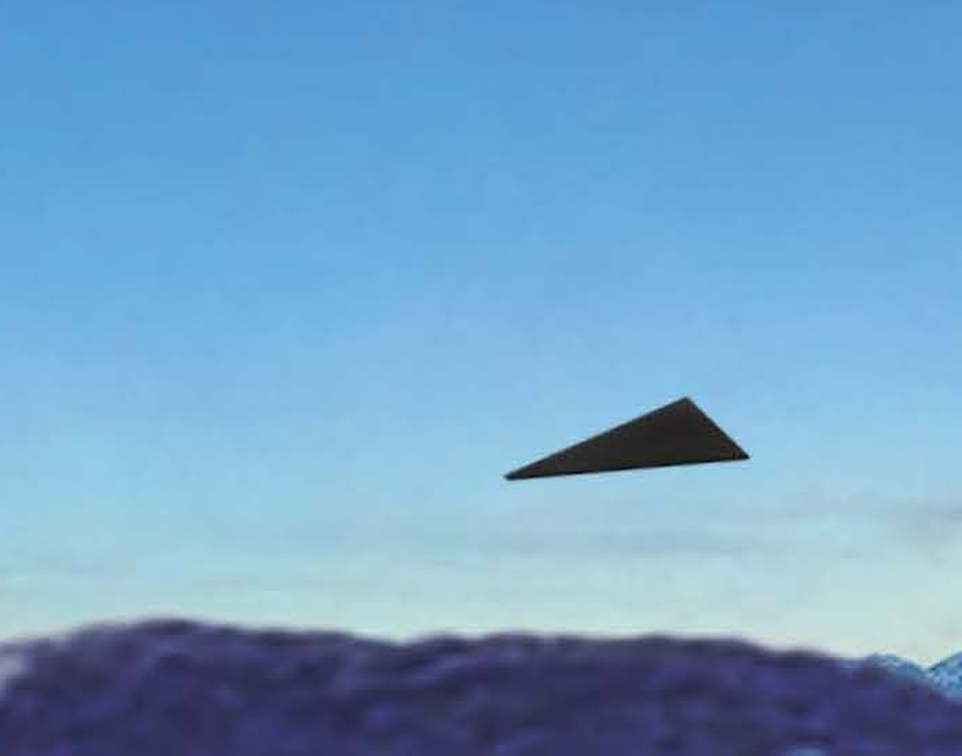 The drawn object enlarged from page 6 of FBI-UAP-D043, showing the banked triangular silhouette AARO's memorandum describes as flattening into a more symmetrical isosceles triangle under banking angle (public domain).